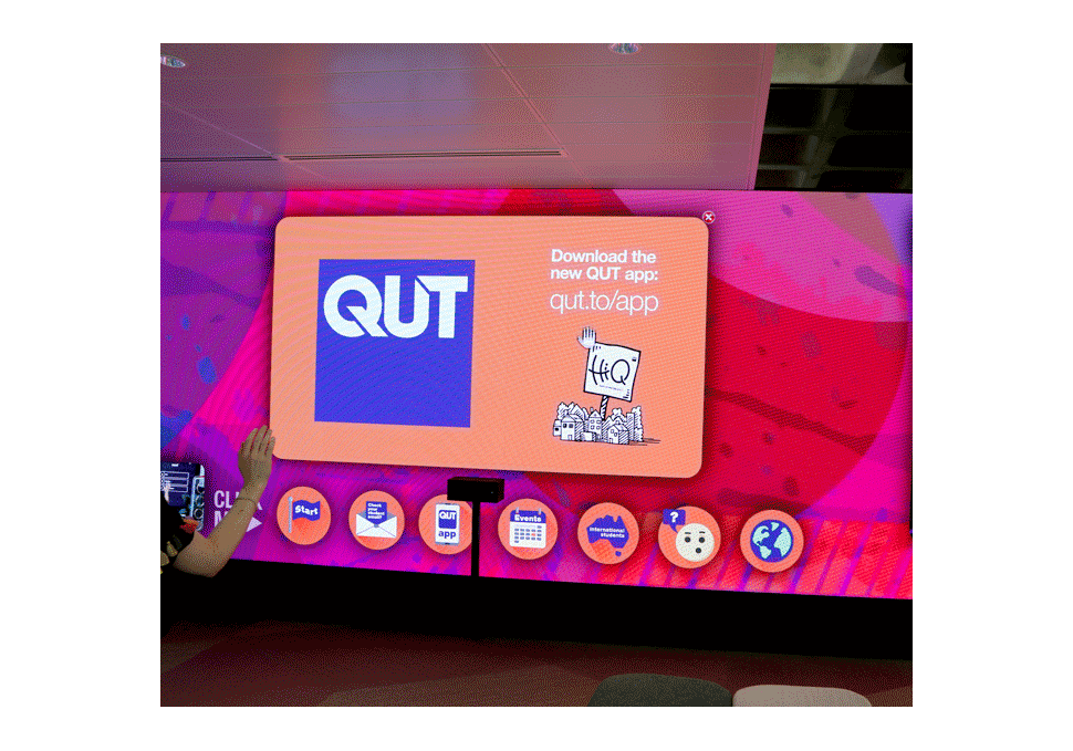 Graphic design, student moving content on large LED screen at HiQ Gardens Point QUT using Kinect cameras, with digital content by Maya Walker