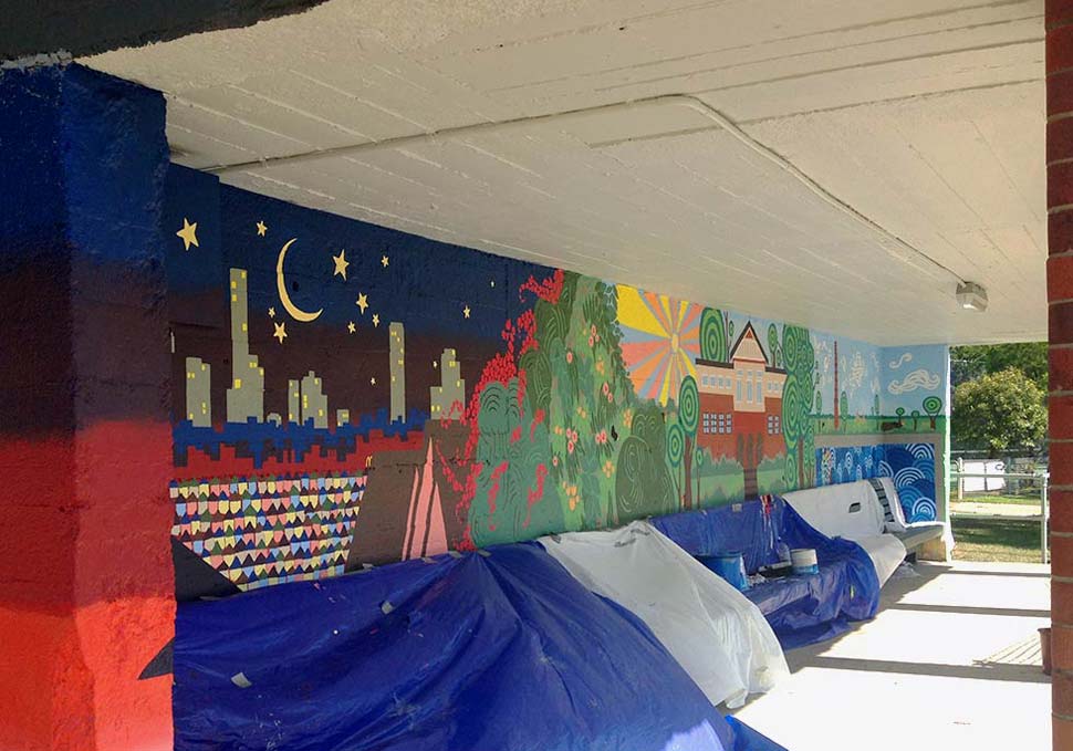 Art, mural painted at bus stop featuring brightly coloured landscape of Newmarket, by Maya Walker